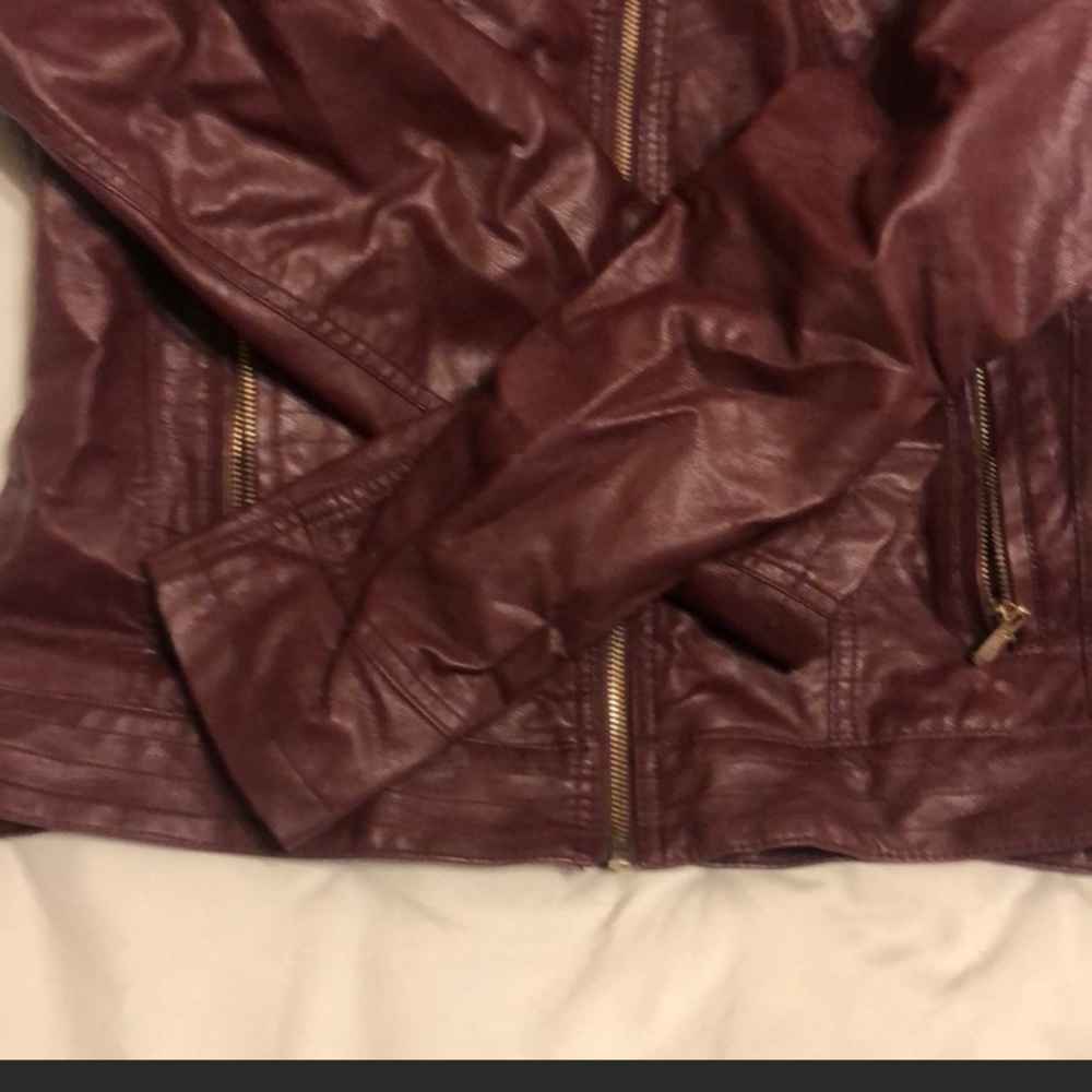Beautiful Faux leather hooded jacket. Fits more like a Large. (Runs small)